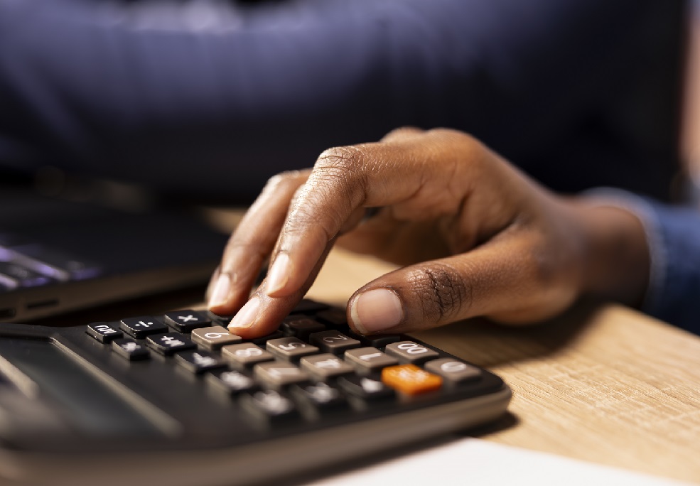 african american young couple review their expenses and taxes reports